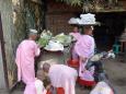 Novice nuns collect the offerings